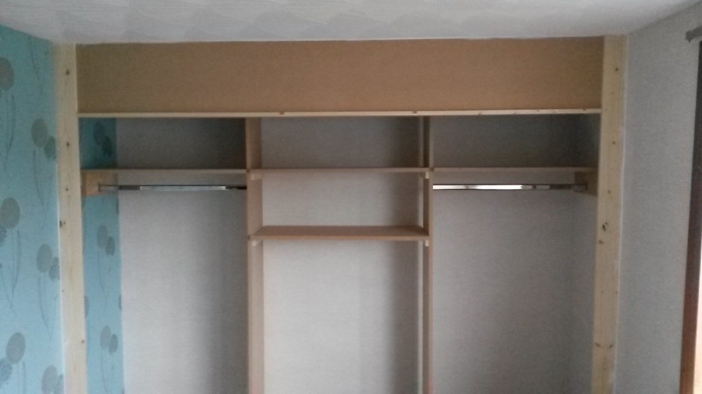 Wardrobe with shelving and rails